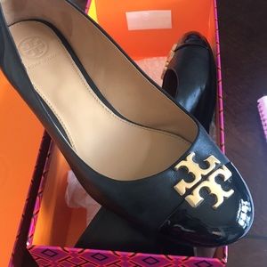Tory Burch Everly 35MM Cap Toe Wedge. Napa leather with patent leather cap-toe.